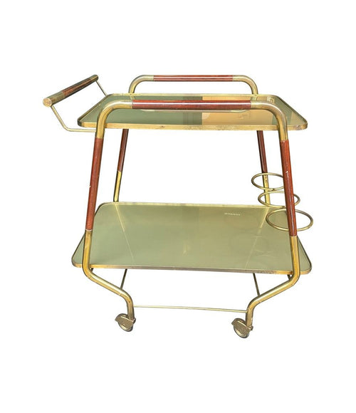 Vintage drinks trolley by Cesare Lacca, gold and lacquered wood with gold painted glass shelves, brass bottle holder and original brass castors. Italian Circa 1950s 