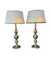 A pair of large Italian 1970s solid brass lamps with orignal satin shades