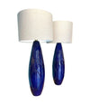 A pair of Italian 1980s large blue ceramic and brass lamps, rewired with with new fittings and linen shades