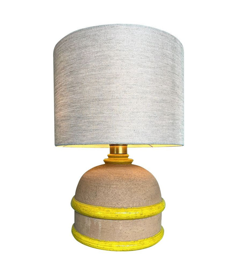 An Italian 1970s ceramic lamp with yellow and natural clay finish with brass fittings