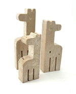 A set of three 1970s Fratelli Mannelli travertine giraffes