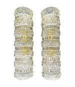 A pair of 1960s clear geometric textured glass wall lights