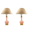 A large pair of Paul Hanson 1950s lamps with pink Murano opaline glass bases, mounted on sold brass bases