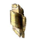 A pair of Danish 1960s torch cut brass wall sconces by Holm Sorensen.