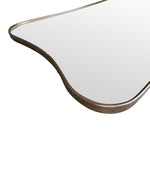 A lovely shaped, orignal Italian 1950s curvaceous brass framed mirror with orignal plate