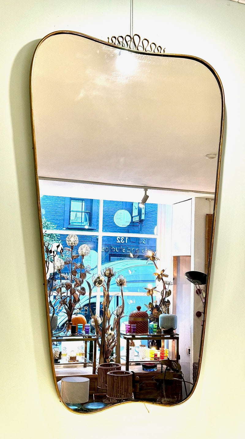 A lovely shaped large original 1950s brass framed mirror in the style of Gio Ponti