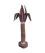 An unusual palm tree floor lamp with real palm trunk wooden base and wooden shaped leaves