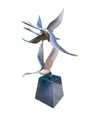 A French 1960s Mid century bronze sculpture by Lumiere of three flying swans mounted on a bronze base,