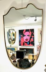 An orignal Italian 1950s shield mirror with orignal mirror plate