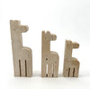 A set of three 1970s Fratelli Mannelli travertine giraffes