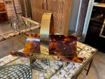 A very chic Italian 1970s faux tortoise shell and brass magazine rack