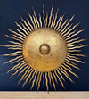 A pair of large 1950s Spanish sunburst wrought iron wall sconces