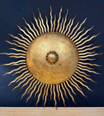 A pair of large 1950s Spanish sunburst wrought iron wall sconces
