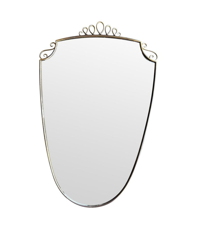 An orignal pair of 1950s Gio Ponti style Italian portrait brass framed mirror with brass top scroll detailing