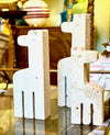 A set of three 1970s Fratelli Mannelli travertine giraffes