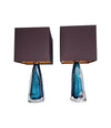 A pair of 1960s Orrefors turquoise glass and brass lamps with new bespoke linen shades