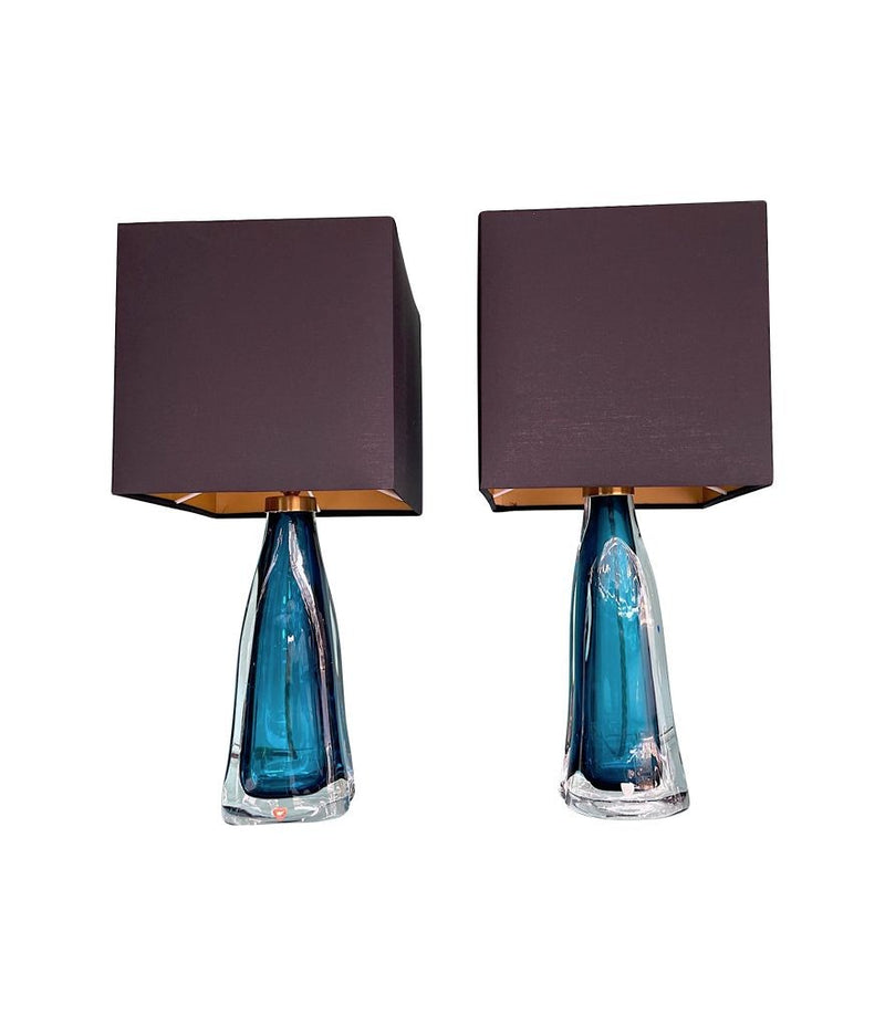 A pair of 1960s Orrefors turquoise glass and brass lamps with new bespoke linen shades