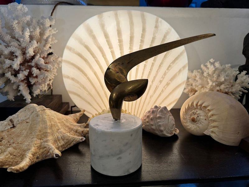 An Italian midcentury abstract 1960s bronze sculpture mounted on a circular Carrara marble base.