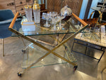 A 1980s Gallotti and Radice “Mister” bar trolley with brass frame and cherry wood handles.