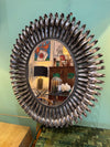A Spanish 1960s silvered metal landscape or portrait oval eyelash mirror