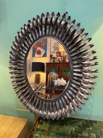 A Spanish 1960s silvered metal landscape or portrait oval eyelash mirror