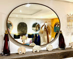 A large orignal Italian 1960s oval brass framed mirror