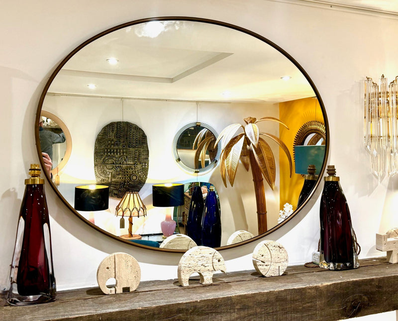 A large orignal Italian 1960s oval brass framed mirror