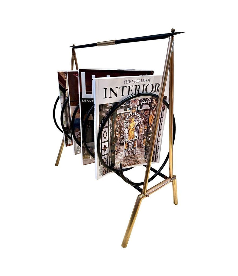 An unusual Italian 1950s mid century brass and black lacquered spiral magazine rack