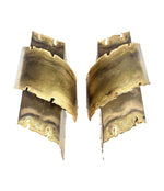 A pair of Danish 1960s torch cut brass wall sconces by Holm Sorensen.