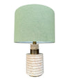 A large Fratelli Manneli ribbed Italian 1970s travertine lamp with brass detail