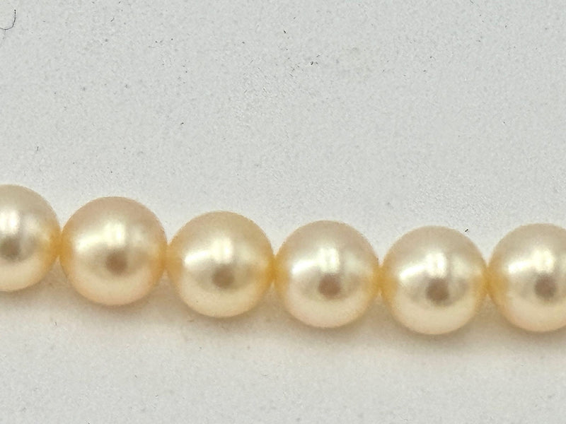 A lovely late 1980s Mappin and Webb Akoya pearl necklace with 18carat gold clasp in orignal box