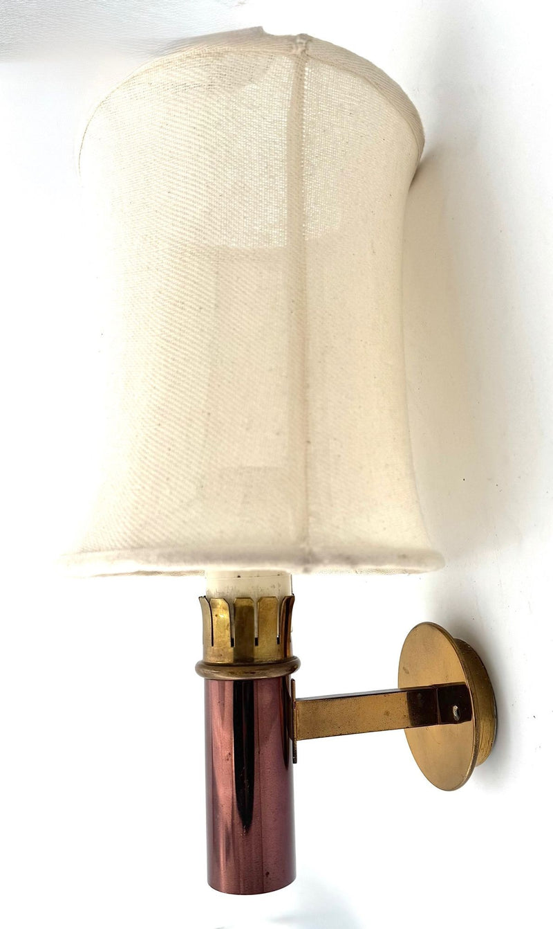 A rare pair of orignal 1960s copper and brass wall sconces by Stilnovo, with orignal labels