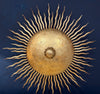 A pair of large 1950s Spanish sunburst wrought iron wall sconces