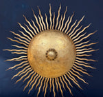 A pair of large 1950s Spanish sunburst wrought iron wall sconces
