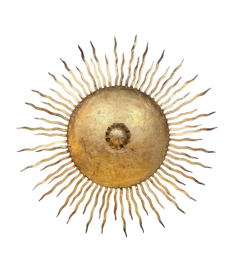 A pair of large 1950s Spanish sunburst wrought iron wall sconces