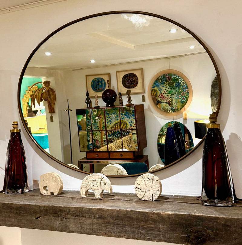 A large orignal Italian 1960s oval brass framed mirror