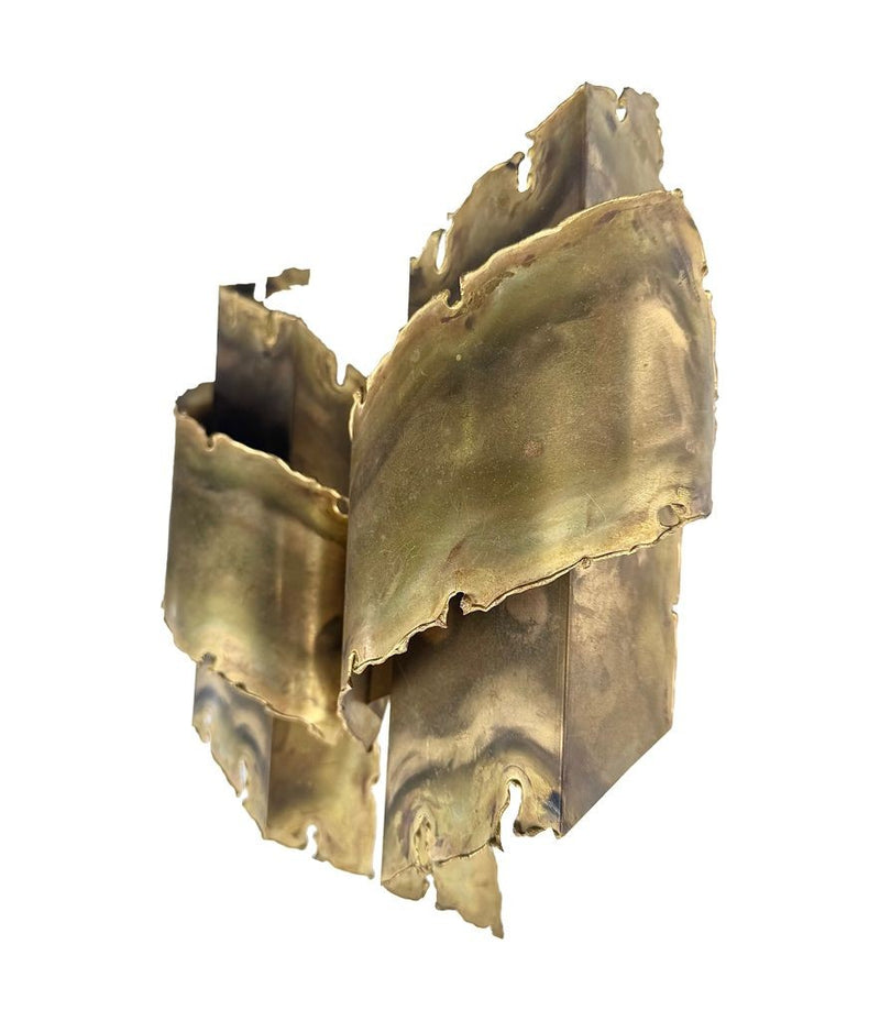 A pair of Danish 1960s torch cut brass wall sconces by Holm Sorensen.