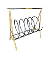 An unusual Italian 1950s mid century brass and black lacquered spiral magazine rack