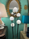 An orignal 1950s Stilnovo "Arberello" black lacquer and brass six light floor lamp