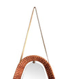 An unusual Italian 1950s diamond shaped woven rattan and brass framed mirror with leather hanging strap