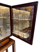 An Italian 1940s mirrored birdseye maple wood and mahogany bar cabinet by Osvaldo Borsani