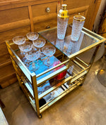 Mid century Romeo Rega Italian gilt metal bar trolley with smoked glass shelves