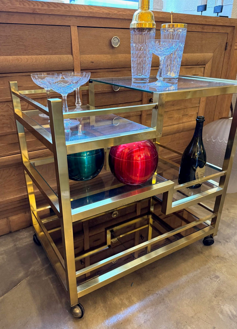 Mid century Romeo Rega Italian gilt metal bar trolley with smoked glass shelves