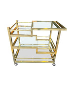 Mid century Romeo Rega Italian gilt metal bar trolley with smoked glass shelves