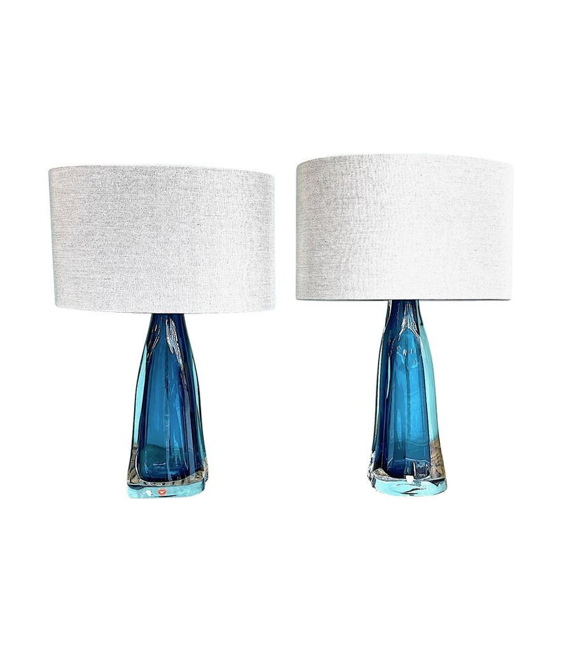 A pair of 1960s Orrefors turquoise glass and brass lamps with new bespoke linen shades