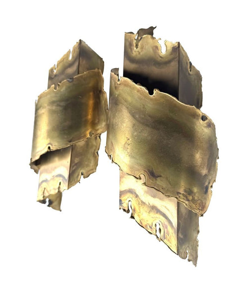 A pair of Danish 1960s torch cut brass wall sconces by Holm Sorensen.