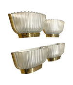 A lovely pair of 1940s Art Deco opaque Murano glass ribbed wall sconces by Seguso with brass wall mounts