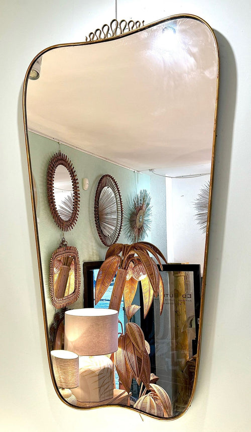 A lovely shaped large original 1950s brass framed mirror in the style of Gio Ponti