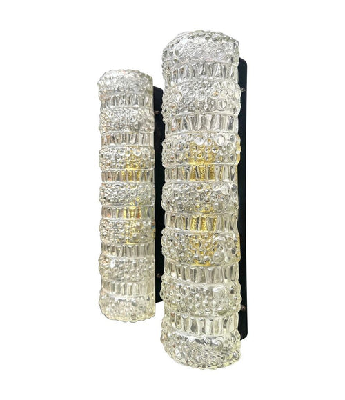 A pair of 1960s clear geometric textured glass wall lights
