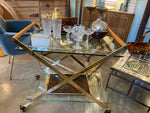 A 1980s Gallotti and Radice “Mister” bar trolley with brass frame and cherry wood handles.